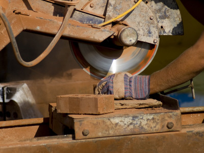 Worker Cutting Bricks by Benoit David Pricing Limited Edition Print image