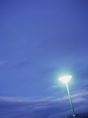 Green Streetlight Beneath Dark Blue Sky, Iceland by Atli Mar Hafsteinsson Pricing Limited Edition Print image