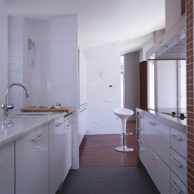 Casa Muntaner, Igualada, White Narrow Galley Kitchen, Architect: Xavier Claramunt by Eugeni Pons Pricing Limited Edition Print image