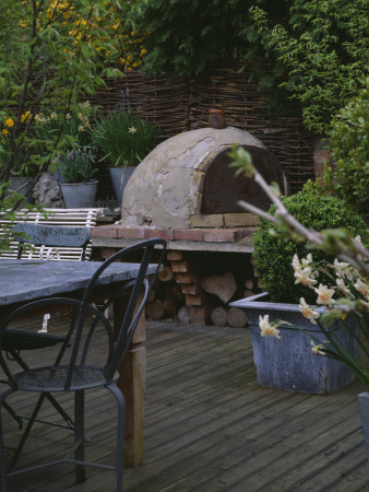 Decked Terrace With Lead Table And Chairs, Box Balls And Barbeque, Designer: Lisette Pleasance by Clive Nichols Pricing Limited Edition Print image