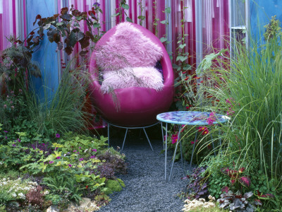 Pink Fluid Filled Walls, Pink Chair And Pink Cushions, Designer: Wendy Smith And Fern Alder by Clive Nichols Pricing Limited Edition Print image