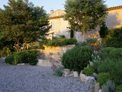 La Chabaude, France, Designer: Scott Stover: Gravel Terrace And Stone Water Feature By The House by Clive Nichols Pricing Limited Edition Print image
