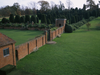 Packwood House, Warwickshire - The Topiary Garden Seen From The Walled Garden by Clive Nichols Pricing Limited Edition Print image