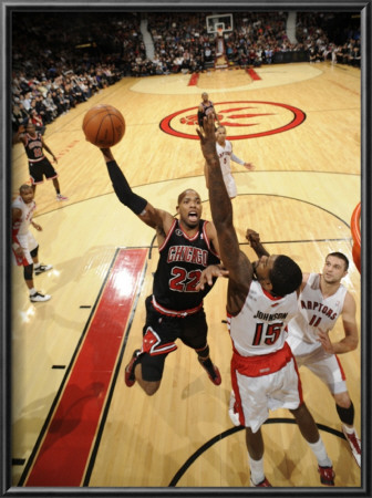 Chicago Bulls V Toronto Raptors: Taj Gibson And Amir Johnson by Ron Turenne Pricing Limited Edition Print image