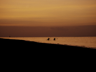 Kayakers At Sunset, Indonesia by Michael Brown Pricing Limited Edition Print image