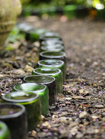 Upturned Bottles Used As Path Edging Feature In An Urban Garden, Norfolk, Uk by Gary Smith Pricing Limited Edition Print image
