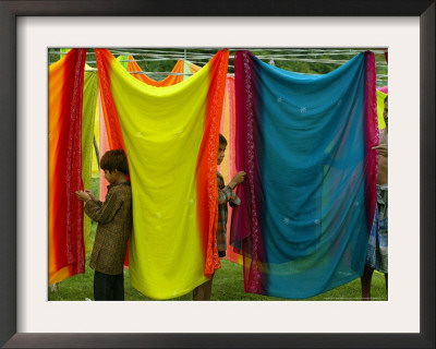 A Washerman With His Children Hang Clothes by Rajesh Kumar Singh Pricing Limited Edition Print image