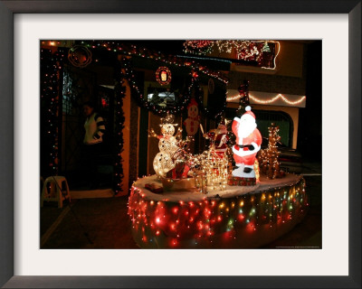 Residents Of A Neighborhood Which Have The Tradition To Decorate During Christmas by Luis Romero Pricing Limited Edition Print image
