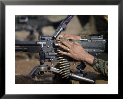 A Marine Loads A M-240G by Stocktrek Images Pricing Limited Edition Print image