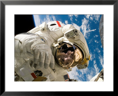An Astronaut Mission Specialist Participates In The Mission's Extravehicular Activity by Stocktrek Images Pricing Limited Edition Print image