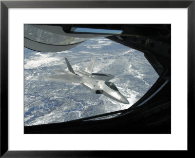 F-22 Raptor Banks Away From A Kc-135 Statotanker During A Refueling Operation by Stocktrek Images Pricing Limited Edition Print image