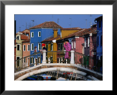 People Crossing Bridge Over A Canal, Burano, Veneto, Italy by Roberto Gerometta Pricing Limited Edition Print image