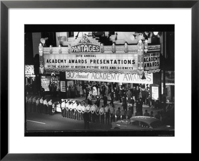 Parking Attendants Ready To Park The Cars Of Celebrities Arriving At The 30Th Annual Academy Awards by Ralph Crane Pricing Limited Edition Print image