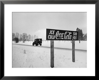 Coca Cola Road Sign On Autobahn Between Munich And Salzburg With Jep Driving by Walter Sanders Pricing Limited Edition Print image