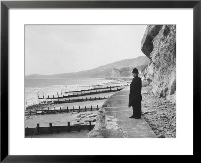 British Police Officer Standing At Foot Of Dover Cliffs, Where Proposed Dover-Calais Tunnel by Ralph Crane Pricing Limited Edition Print image