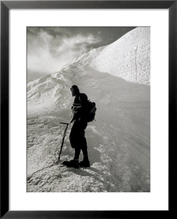 Portrait Of A Mountaineer With A Pick, Rope And Backpack On A Mountainous Peak Covered In Snow by A. Villani Pricing Limited Edition Print image