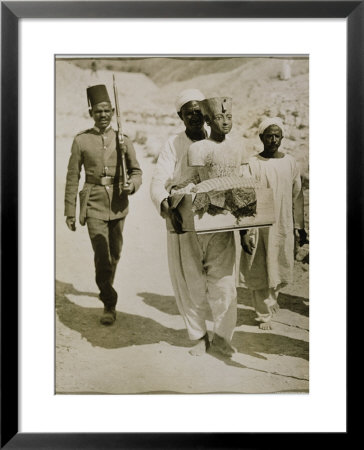 The Mannequin Or Bust Of Tutankhamun Being Carried From The Tomb, Valley Of The Kings, 1922 by Harry Burton Pricing Limited Edition Print image