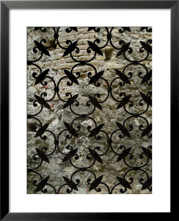 Ornate Iron Gate In Front Of A Brick Wall, Asolo, Italy by Todd Gipstein Pricing Limited Edition Print image