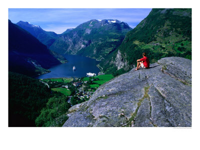 Man Resting On Rock Watching Cruise Ship Sail Out Of Geirangerfjord, Geiranger, Norway by Anders Blomqvist Pricing Limited Edition Print image