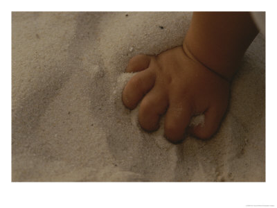 A Childs Hand Grasps A Fistfull Of White Sand by Raul Touzon Pricing Limited Edition Print image