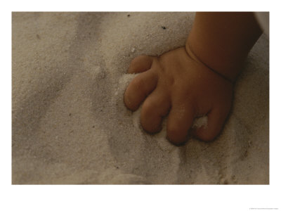 A Childs Hand Grasps A Fistfull Of White Sand by Raul Touzon Pricing Limited Edition Print image