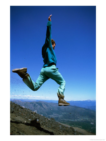 A Hiker Takes A Giant Leap Atop A Mountain In Chile by Barry Tessman Pricing Limited Edition Print image
