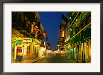 Flags Hanging Over The Empty Bourbon Street At Night, New Orleans, Louisiana, U.S.A. by Richard Cummins Pricing Limited Edition Print image
