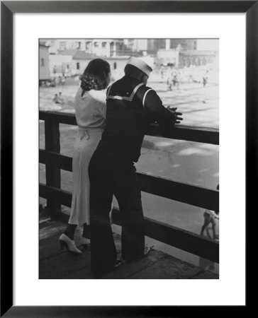 Sailor On Shore Leave Standing On Pier With A Young Woman by Peter Stackpole Pricing Limited Edition Print image