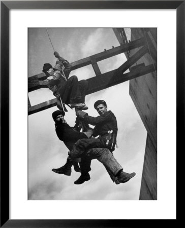 Relief Workers Hanging From Cable In Front Of A Giant Beam During The Construction Of Fort Peck Dam by Margaret Bourke-White Pricing Limited Edition Print image