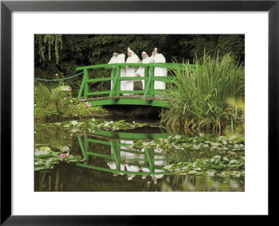 Four Nuns Standing On The Japanese Bridge In The Garden Of The Impressionist Painter Claude Monet by David Hughes Pricing Limited Edition Print image
