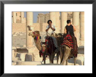 Young Men On Camels, Archaelogical Ruins, Palmyra, Unesco World Heritage Site, Syria, Middle East by Christian Kober Pricing Limited Edition Print image