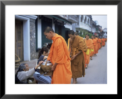 Novice Buddhist Monks Collecting Alms Of Rice, Luang Prabang, Laos, Indochina, Southeast Asia, Asia by Upperhall Ltd Pricing Limited Edition Print image