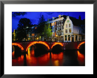 Illuminated Canal And Houses, Amsterdam, North Holland, Netherlands by Jon Davison Pricing Limited Edition Print image