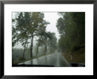 View Through The Window Of A Car Driving Through The Rain In Tuscany, Italy by Todd Gipstein Pricing Limited Edition Print image