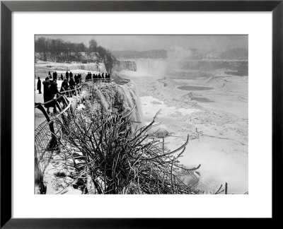 View Of Visitors Watching Ice Formations At The American Side Of A Frozen Niagara Falls by Margaret Bourke-White Pricing Limited Edition Print image