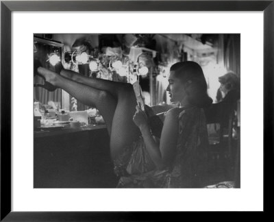 Chorus Girl-Singer Linda Lombard, Resting Her Legs After A Tough Night On Stage by George Silk Pricing Limited Edition Print image