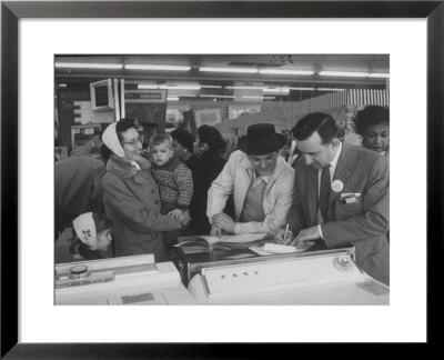 Shoppers Looking At Appliances In Polk's Department Store by Francis Miller Pricing Limited Edition Print image