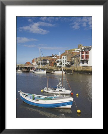 Whitby Church And Fishing Boats In The Harbour, Whitby, North Yorkshire, Yorkshire, England, Uk by Neale Clarke Pricing Limited Edition Print image