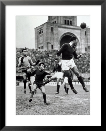 Soccer Players During A Game, Fighting For The Ball by A. Villani Pricing Limited Edition Print image