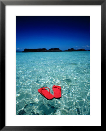 Red Thongs Floating On Sea Off Ko Kham, Thailand by Woods Wheatcroft Pricing Limited Edition Print image