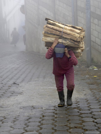 Man Carrying Load Of Firewood Up Steep Stone Street, Zunil, Guatemala by Dennis Kirkland Pricing Limited Edition Print image