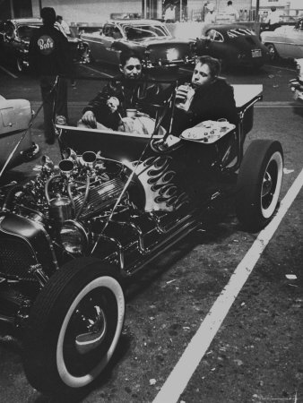Hot Rodder Norm Grabowsky, At The Wheel Of His Ford Roadster Featuring An Exposed Cadillac Engine by Ralph Crane Pricing Limited Edition Print image