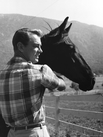 Portrait Of Actor Alan Ladd Standing Beside A Horse by Alfred Eisenstaedt Pricing Limited Edition Print image