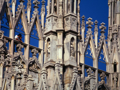 Tourists Standing Among Spires Of Milan Cathedral, Milan, Italy by Jon Davison Pricing Limited Edition Print image