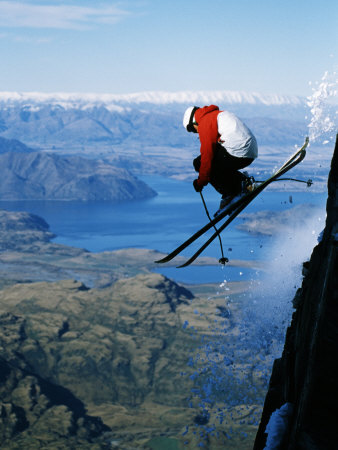 Skier Dropping Off Cliff At Treble Cone Ski Resort, Near Wanaka, Wanaka, New Zealand by Christian Aslund Pricing Limited Edition Print image