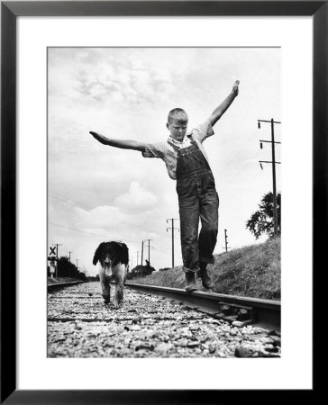 Larry Jim Holm, 12, With Dunk, Spaniel Collie Mix, Walking Rail Of Railroad Tracks In Rural Area by Myron Davis Pricing Limited Edition Print image