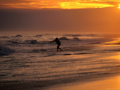 Man Fishing On Lake Tyers Beach At Sunset, Lakes Entrance, Australia by Chris Mellor Pricing Limited Edition Print image