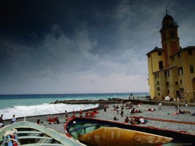Boats And People On Pebble Beach During Stormy Day, Camogli, Liguria, Italy by Diana Mayfield Pricing Limited Edition Print image
