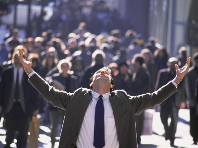 Businessman Holding Hands Up In Joy On Busy Street by Henryk T. Kaiser Pricing Limited Edition Print image