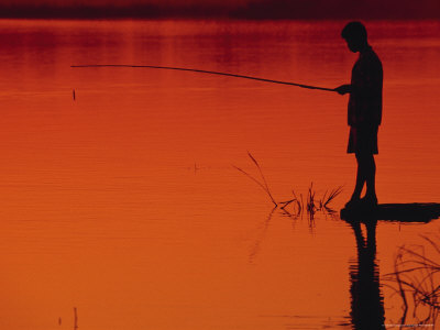 Boy Fishing, Sunset, Myanmar by Inga Spence Pricing Limited Edition Print image
